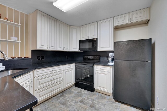 1308 S Danube Way Unit 102, Aurora, CO 80017 - kitchen with black appliances, a sink, dark countertops, and white cabinetry