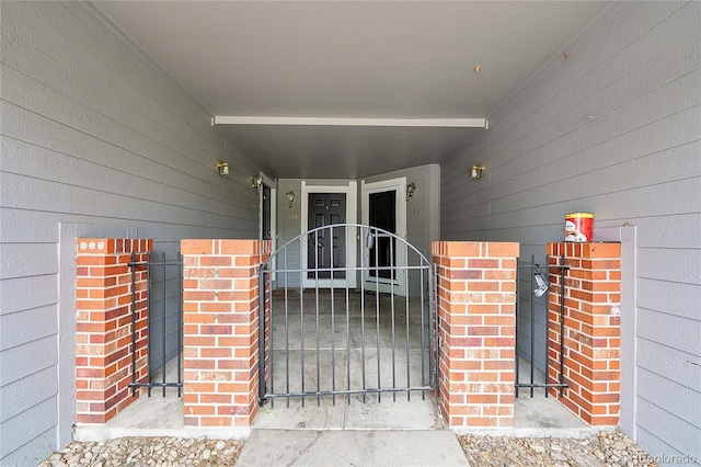 1308 S Danube Way Unit 102, Aurora, CO 80017 - doorway to property featuring a gate and brick siding