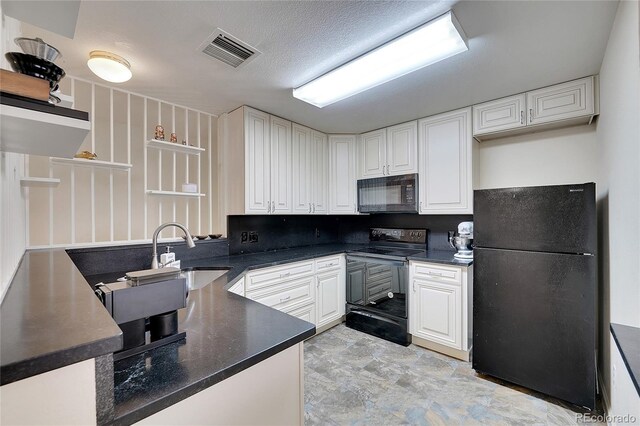 1308 S Danube Way Unit 102, Aurora, CO 80017 - kitchen featuring black appliances, a sink, dark countertops, white cabinets, and open shelves