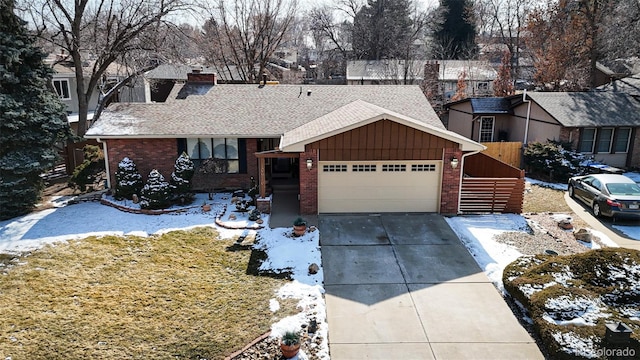 single story home featuring a garage, brick siding, fence, concrete driveway, and a chimney