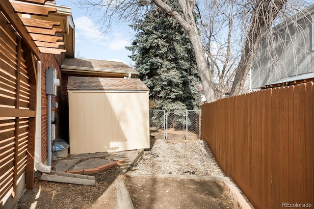 view of yard with a storage shed and fence