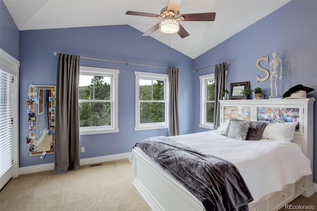 bedroom with light carpet, ceiling fan, and lofted ceiling