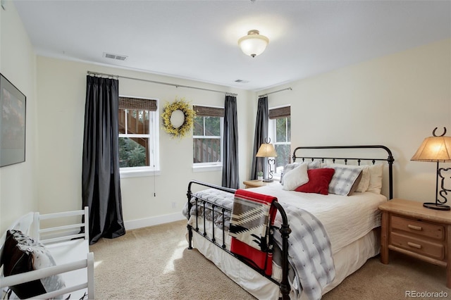 bedroom with light colored carpet