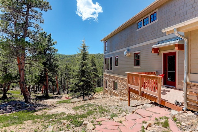 view of yard featuring a wooden deck