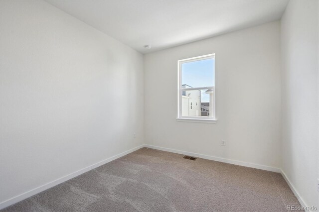 1257 Rhett Dr, Erie, CO 80026 - spare room featuring carpet flooring and baseboards