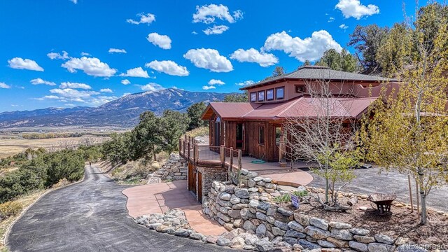 12220 Saddle Ridge Ln, Salida, CO 81201 - view of front of home featuring a mountain view and a patio