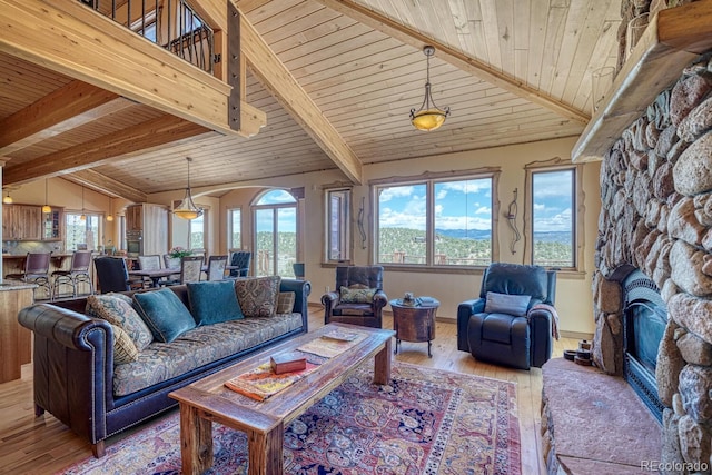 12220 Saddle Ridge Ln, Salida, CO 81201 - living room featuring wood-type flooring, a fireplace, and wooden ceiling