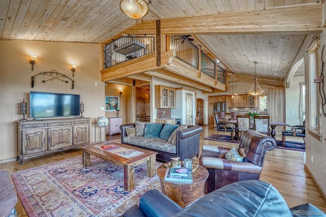 12220 Saddle Ridge Ln, Salida, CO 81201 - living area featuring vaulted ceiling, light wood finished floors, baseboards, and wood ceiling