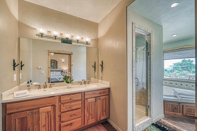 12220 Saddle Ridge Ln, Salida, CO 81201 - bathroom featuring a shower stall, ensuite bath, double vanity, and a tub to relax in
