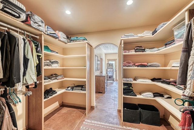 12220 Saddle Ridge Ln, Salida, CO 81201 - walk in closet with tile patterned floors and arched walkways
