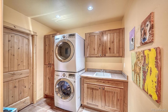 12220 Saddle Ridge Ln, Salida, CO 81201 - washroom with stacked washer and clothes dryer, cabinet space, and recessed lighting