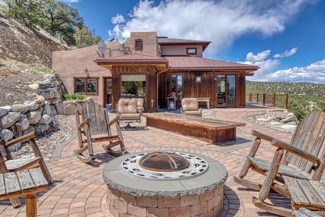 12220 Saddle Ridge Ln, Salida, CO 81201 - view of patio with a fire pit