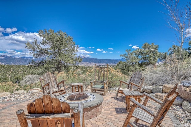 12220 Saddle Ridge Ln, Salida, CO 81201 - view of patio / terrace featuring a fire pit and a mountain view