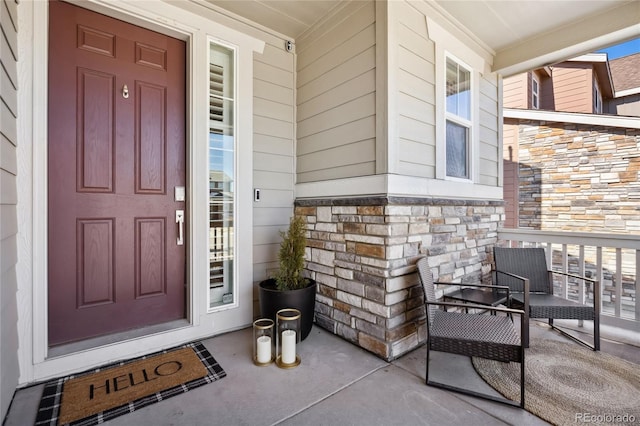 doorway to property featuring stone siding