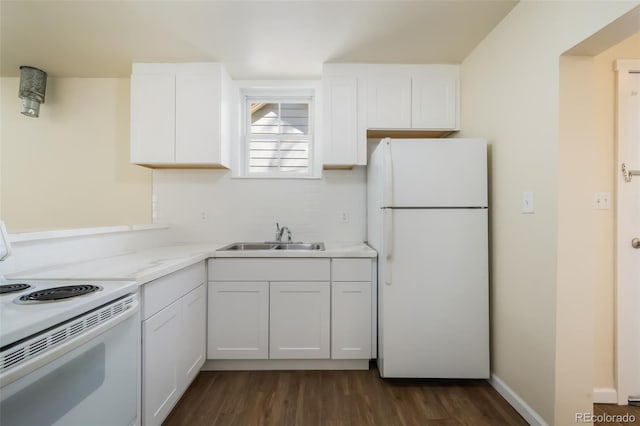 kitchen featuring dark hardwood / wood-style flooring, light stone counters, white appliances, sink, and white cabinets