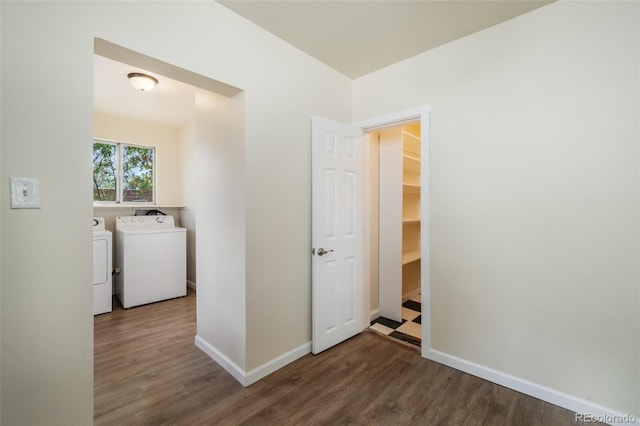 washroom with washer and dryer and dark hardwood / wood-style floors