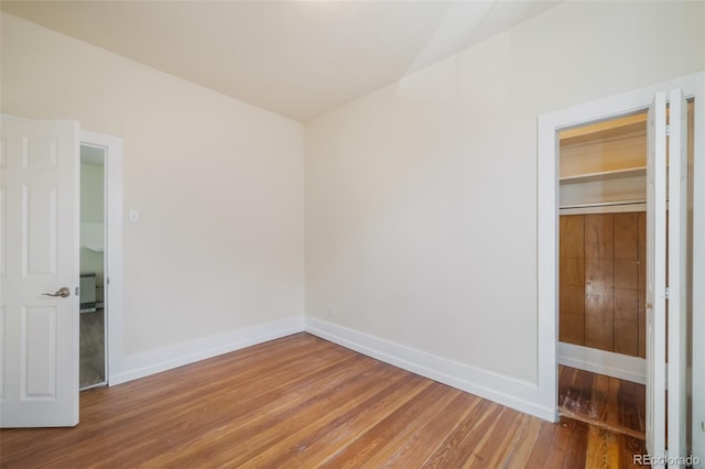 unfurnished room featuring hardwood / wood-style floors