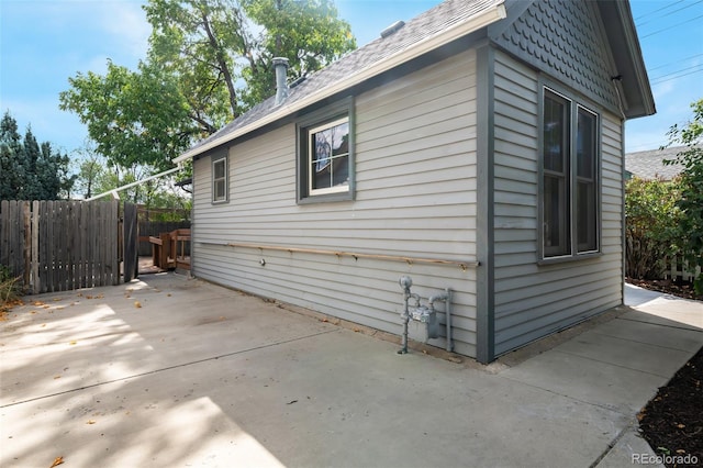 view of side of property featuring a patio area