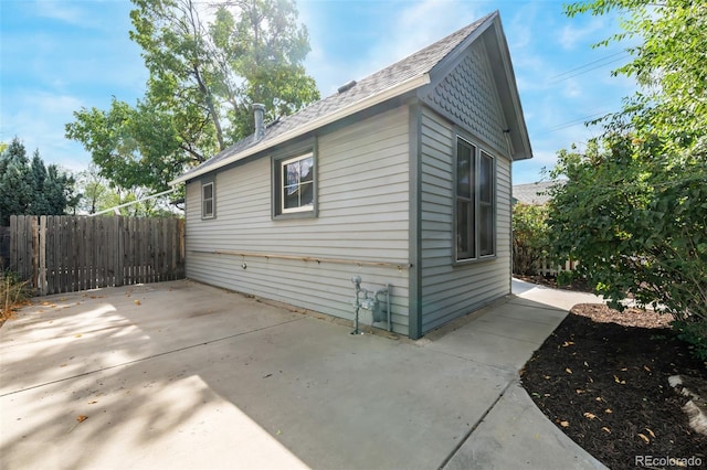 view of side of home featuring a patio