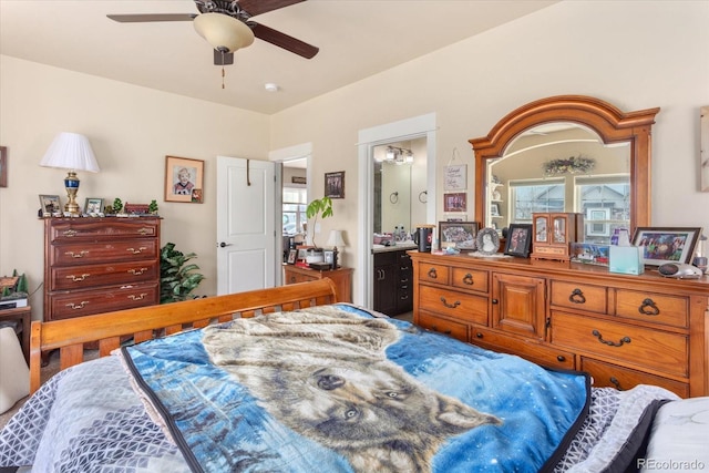 bedroom featuring connected bathroom and a ceiling fan