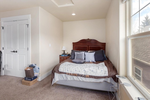 carpeted bedroom featuring attic access and recessed lighting