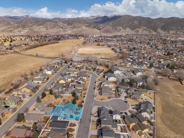 birds eye view of property with a residential view and a mountain view