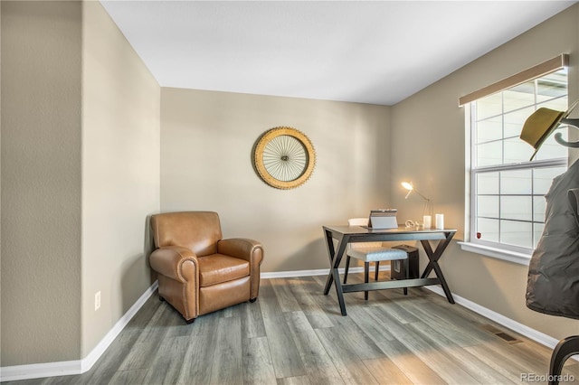 office area featuring baseboards and wood finished floors