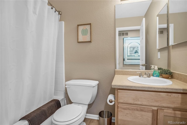 full bathroom featuring shower / bath combination with curtain, visible vents, vanity, toilet, and a textured wall