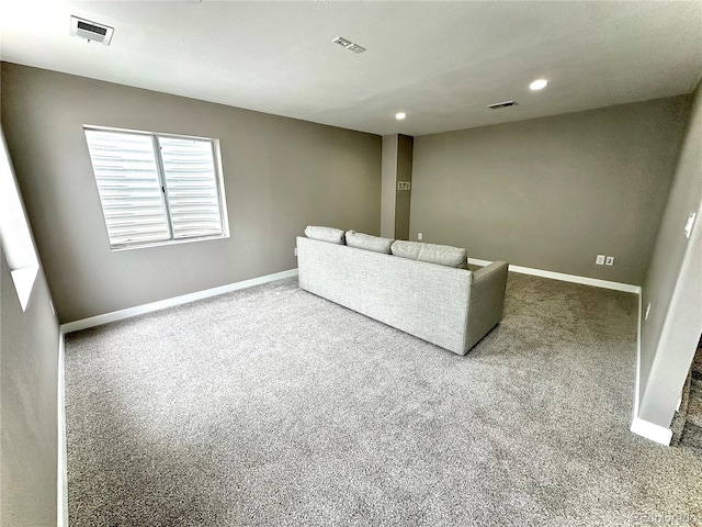 unfurnished living room featuring baseboards, carpet, recessed lighting, and visible vents
