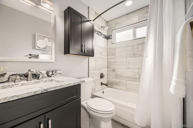 full bath featuring shower / bath combination with curtain, toilet, and vanity