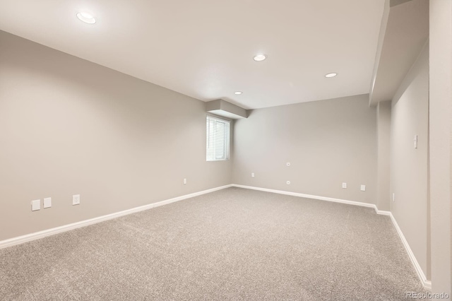 carpeted spare room with recessed lighting and baseboards