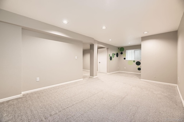 basement with recessed lighting, baseboards, and light carpet