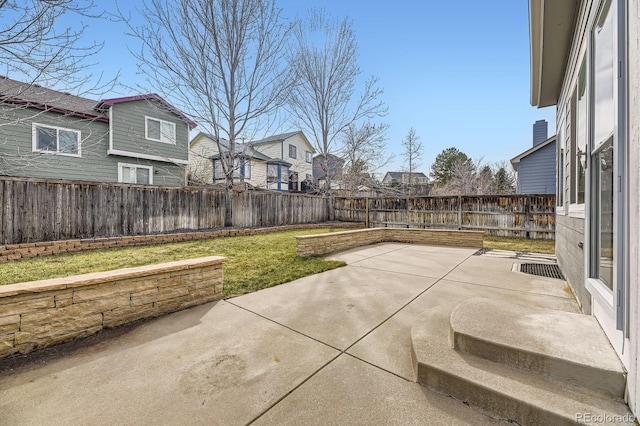 view of patio with a residential view and a fenced backyard