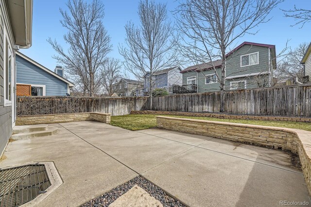 view of patio / terrace featuring a residential view and a fenced backyard