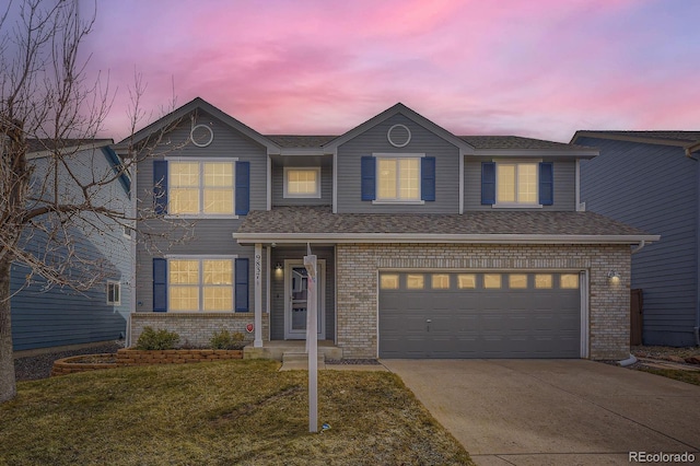 traditional-style home with a garage, brick siding, concrete driveway, and a shingled roof