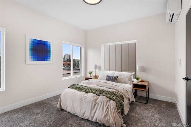 bedroom featuring dark carpet and a wall unit AC