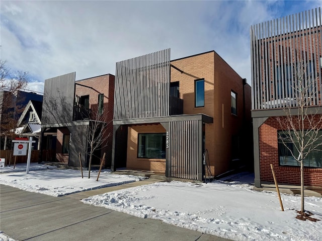 view of front of house with brick siding