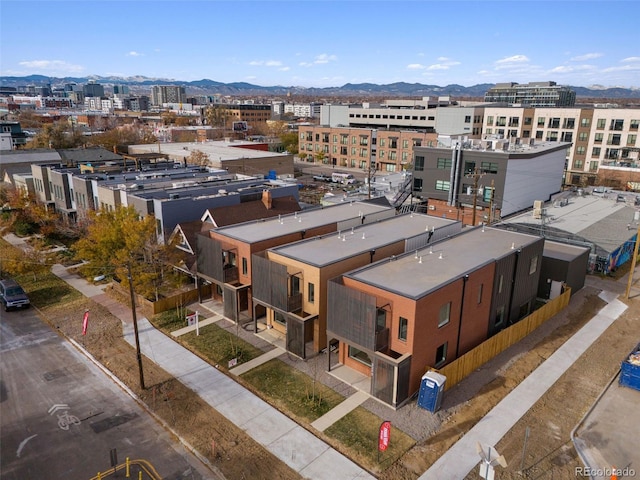 birds eye view of property with a mountain view and a view of city