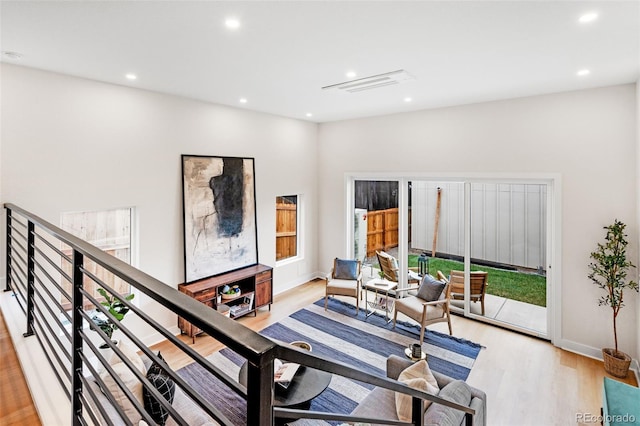 sitting room with recessed lighting, visible vents, baseboards, and light wood-style floors