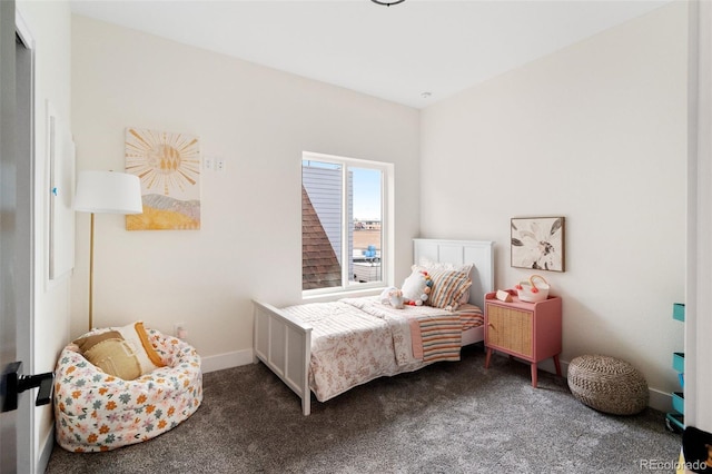 carpeted bedroom featuring baseboards