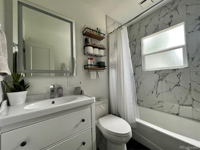 full bath with vanity, toilet, and shower / tub combo with curtain