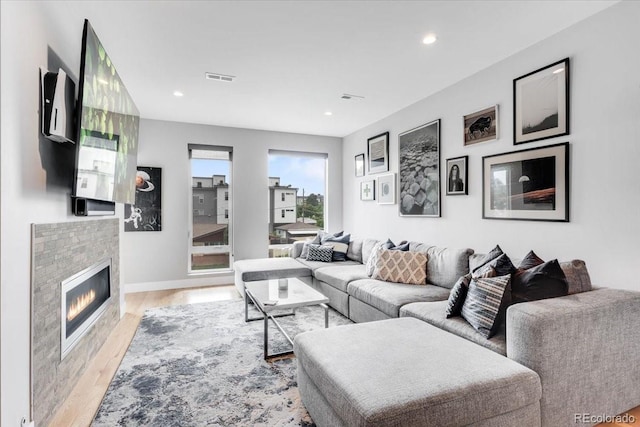 3103 W 18th Ave, Denver, CO 80204 - living room featuring light wood-style floors, a glass covered fireplace, and recessed lighting