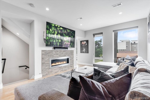3103 W 18th Ave, Denver, CO 80204 - living area with wood finished floors, a stone fireplace, and recessed lighting