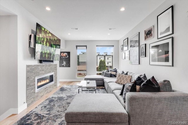 3103 W 18th Ave, Denver, CO 80204 - living room with light wood-style flooring, a tile fireplace, and recessed lighting