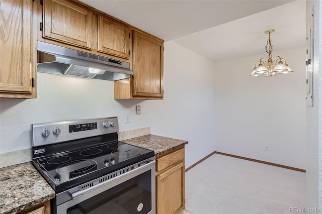 kitchen with decorative light fixtures, an inviting chandelier, dark stone counters, and stainless steel electric range