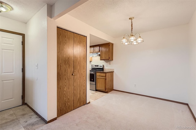 kitchen with hanging light fixtures, a textured ceiling, a chandelier, stainless steel range with electric cooktop, and light colored carpet