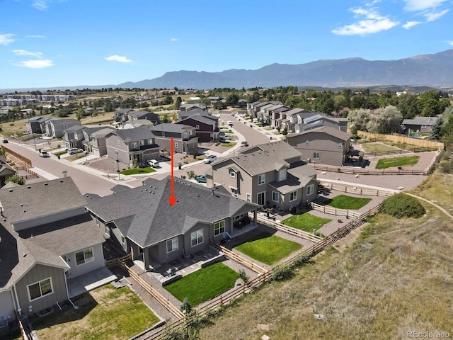 birds eye view of property with a mountain view