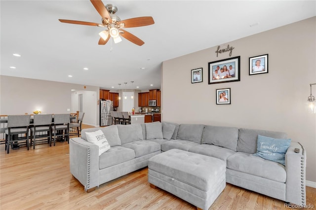 9904 Quintero St, Commerce City, CO 80022 - living area featuring a ceiling fan, light wood finished floors, and recessed lighting