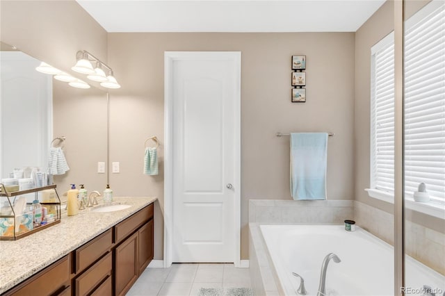 9904 Quintero St, Commerce City, CO 80022 - bathroom featuring vanity, a bath, and tile patterned flooring