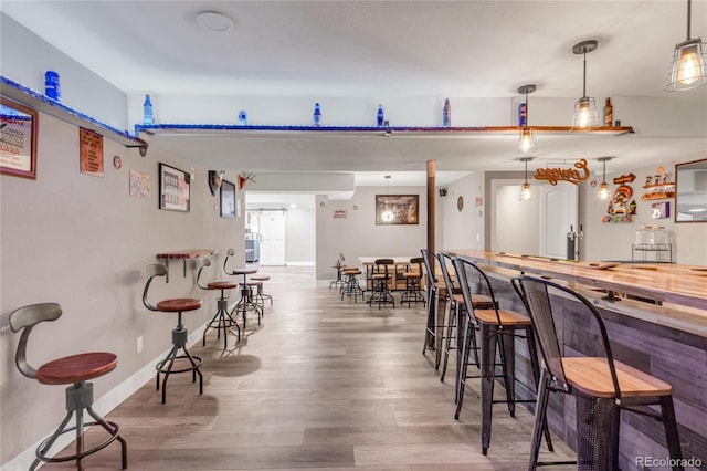 9904 Quintero St, Commerce City, CO 80022 - indoor bar with wood finished floors and baseboards